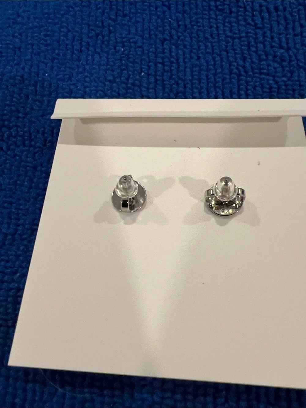 Tory Burch Kira Pearl Flower Stud Earrings, featuring a central Double T logo